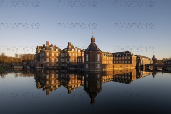 Nordkirchen, castle, completed in 1734, view over the moat in the evening light, Westphalian Versailles