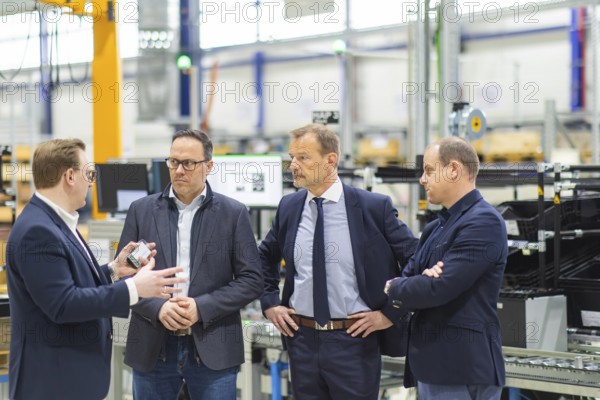 JT Energy Systems is the largest production centre for lithium-ion batteries in the intralogistics industry. On an area of 42, 000 m², lithium-ion batteries are produced and reconditioned to the highest quality standards using modern production technologies. Christoph Remmel (left) from JT Energy Systems, Dirk Panter, Prof Dr Jörg Scheibe, Christian Kleinert - Managing Director - JT Energy, Freiberg, Saxony, Germany, Europe