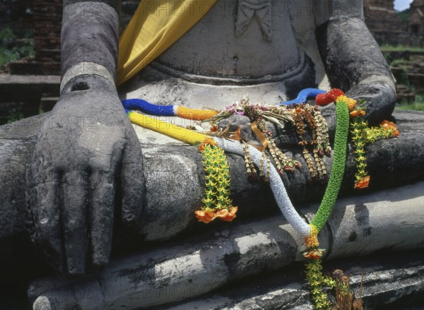 Wat Phra Mahathat was built during the reign of Borommaracha I (Boromma Rachathirat I) or Khun Luang Pa Ngua (1370- 1388), who was the third king of the Ayutthaya Kingdom.<br/><br/> Ayutthaya (Ayudhya) was a Siamese kingdom that existed from 1351 to 1767. Ayutthaya was friendly towards foreign traders, including the Chinese, Vietnamese (Annamese), Indians, Japanese and Persians, and later the Portuguese, Spanish, Dutch and French, permitting them to set up villages outside the city walls. In the sixteenth century, it was described by foreign traders as one of the biggest and wealthiest cities in the East. The court of King Narai (1656–1688) had strong links with that of King Louis XIV of France, whose ambassadors compared the city in size and wealth to Paris