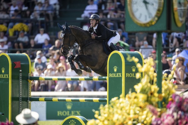 Michael Pender of Ireland and riding HHS Calais compete in the first round of the 1.60m CPKC International during the Spruce Meadows Masters, presented by Rolex, in Calgary, Alberta, Canada, North America
