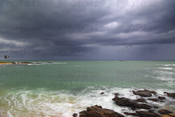 Beautiful sea stormy landscape over rocky coastline in Indian ocean