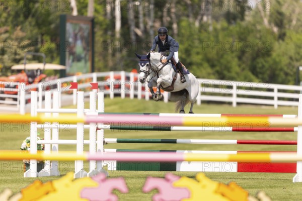 Daniel Bluman of Israel and riding Corbie V.V., compete in the 1.60m Grand Prix during The Continental international competition at Spruce Meadows, in Calgary, Canada, North America