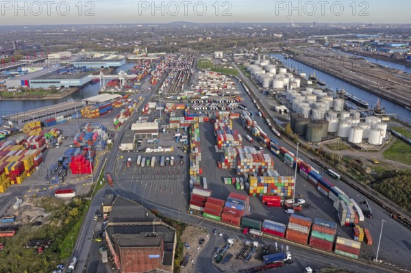 Commercial port with container terminal and oil tanks at the Rhine river in North Rhine-Westphalia, Germany, Europe