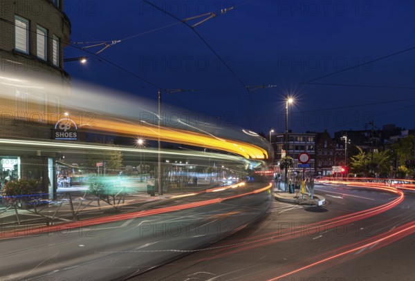 Berchem-Sainte- Agathe, Brussels Capital Region- Belgium, 10 10 2021: Light trails of a tramway passing by