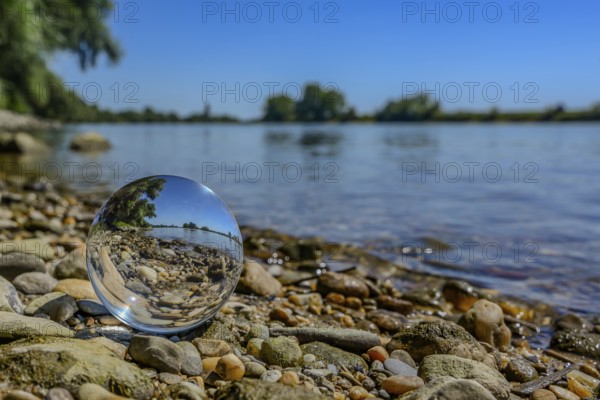Reflections in a glass sphere on the banks of the Danube near Straubing, Lower Bavaria