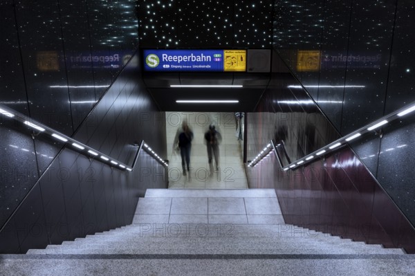 Entrance to the Reeperbahn underground station while two people walk down the stairs, St. Pauli, Free and Hanseatic City of Hamburg, Germany, Europe