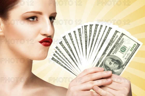 Creative portrait of a naked girl with beautiful face and body holding hand fan made of 100 dollar currency banknotes on colourful abstract cartoon style background