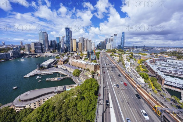 SYDNEY, AUSTRALIA, MARCH 4 2023: The Sydney CBD and surrounding harbour, including Circular Quay and The Rocks on a clear autumn day in Sydney, Australia, Oceania