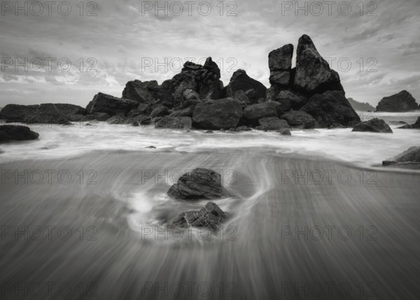 A dramatic sunset seascape at a northern California beach in black and white. USA