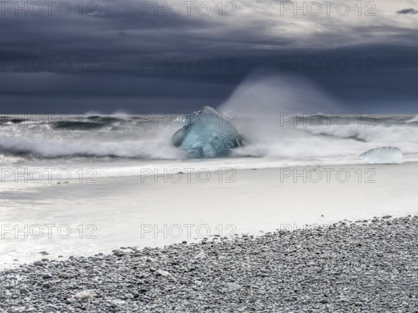 Diamond Beach, iceberg in the surf, near Jökulsarlon glacier lagoon, Vatnajökull National Park, Hornafjörður, South Iceland, Iceland, Europe