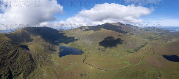 A panorama aerial view of the Mountains of the Central Dingle Peninsula and Connor Pass in County Kerry of Ireland