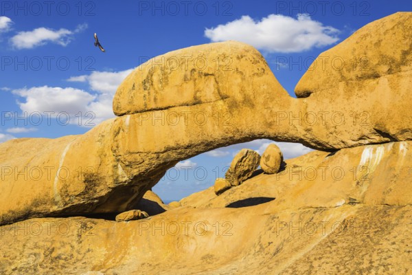Stone arch Spitzkoppe, Namibia. Mountain Nature Reserve in the desert. The concept of extreme and ecological tourism