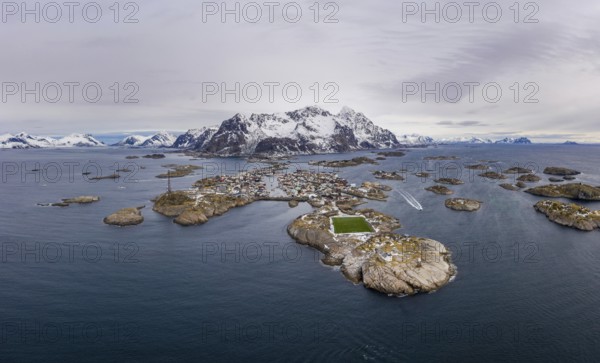 Henningsvaer Fishing Village and Festvagtind Mountain in Winter. Norwegian Sea. Lofoten Islands, Landscape of Norway. Aerial View