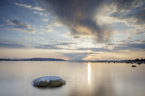 Sunset over a lake, dramatic clouds form in the sky, Seegarten, Allensbach, Lake Constance, Baden-Württemberg, Germany, Europe