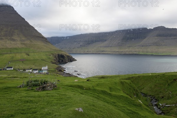 Typical landscape on the Faroe Islands, with green grass and rocks and Vidareidi, Vidareidi, Faroe Islands, Denmark, Europe