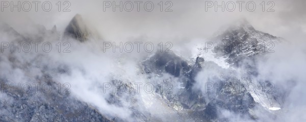 Fantastic snow mountains landscape banner background with snow peaks and clouds, French Alps