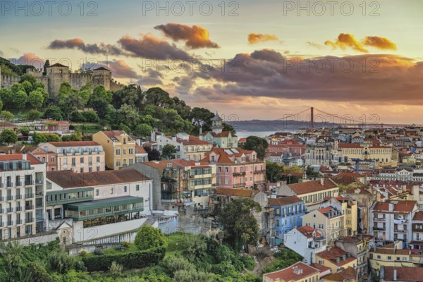 Lisbon Portugal sunset city skyline at Lisbon Baixa district and Saint George Castle