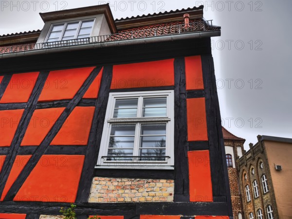 Historic half-timbered house with red and black beams and white windows, stralsund, mecklenburg, germany