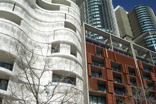 16 Sep 2018, Sydney, New South Wales, Australia, A view of modern residential buildings at Anadara Residence, office towers and restaurants along the pedestrianised Wulugul Walk in Barangaroo South. The buildings are located on the banks of Darling Harbour with the International Towers towering in the background, Oceania