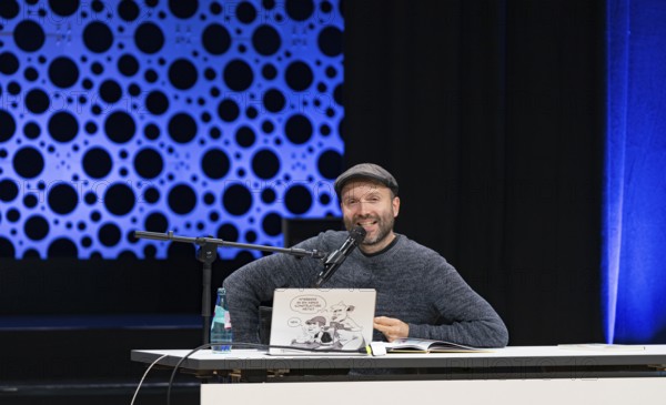 FRANKFURT AM MAIN, Germany, October 22 2023: Marc-Uwe Kling (*1982, German songwriter, author, and cabaret artist) reads at the 75th Frankfurt Book Fair, Europe