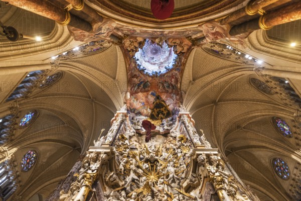 Toledo, Spain, December 16, 2018: Interior of Primate Cathedral of Saint Mary of Toledo. Baroque altarpiece called El Transparente, Europe