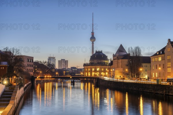 The Spree, the Bode Museum and the television tower in Berlin in front of sunrise