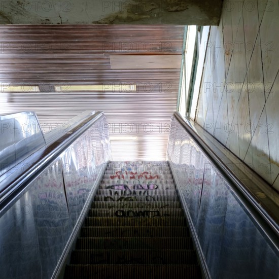 Old, graffitoed escalator at U Yorckstraße subway station in Berlin, Germany in July 2018