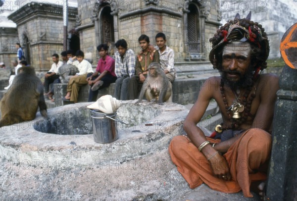 They are known, variously, as sadhus (saints, or 'good ones'), yogis (ascetic practitioners), fakirs (ascetic seeker after the Truth) and sannyasins (wandering mendicants and ascetics). They are the ascetic – and often eccentric – practitioners of an austere form of Hinduism. Sworn to cast off earthly desires, some choose to live as anchorites in the wilderness. Others are of a less retiring disposition, especially in the towns and temples of Nepal's Kathmandu Valley.<br/><br/> If the Vale of Kathmandu seems to boast more than its share of sadhus and yogis, this is because of the number and importance of Hindu temples in the region. The most important temple of Vishnu in the valley is Changunarayan, and here the visitor will find many Vaishnavite ascetics. Likewise, the most important temple for followers of Shiva is the temple at Pashupatinath.<br/><br/> Vishnu, also known as Narayan, can be identified by his four arms holding a sanka (sea shell), a chakra (round weapon), a gada (stic...