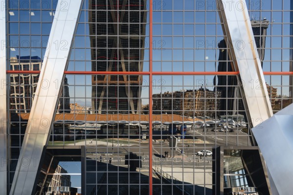 Madrid, Spain, March 20, 2017: Low angle view of The Gate of Europe towers and reflections. They are twin office buildings designed by architect Philip Johnson, Europe