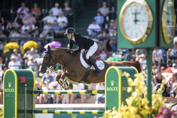 Jana Wargers of Germany and riding Dorette Old compete in the first round of the 1.60m CPKC International during the Spruce Meadows Masters, presented by Rolex, in Calgary, Alberta, Canada, North America