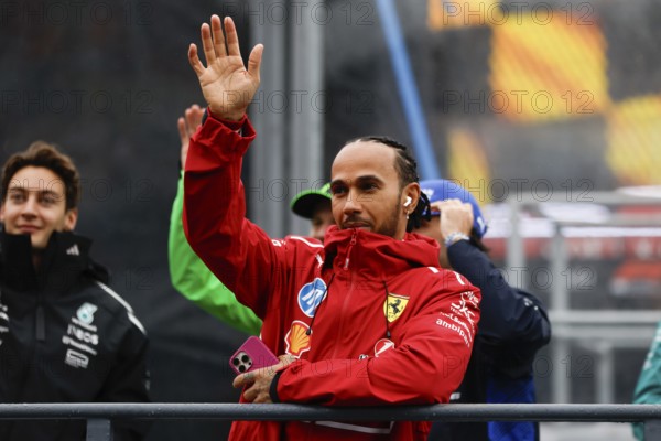 MELBOURNE, AUSTRALIA - MARCH 16: Lewis Hamilton of Great Britain and Scuderia Ferrari during the driver's parade at the 2025 Australian Grand Prix at Albert Park in Melbourne, Australia, Oceania