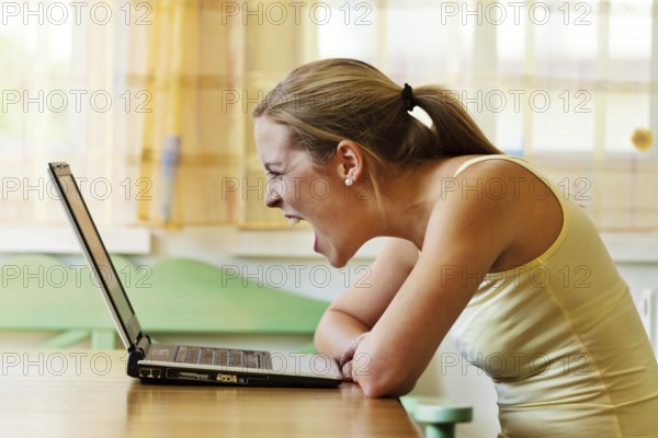 A woman is annoyed with her computer. Problems with hardware, software and internet shopping Austria
