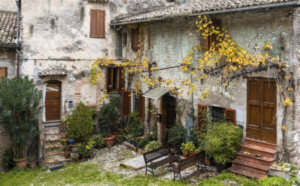 Spoleto, Italy, 25 November, 2022: rustic stone house and small backyard in the historic city center of Spoleto, Europe