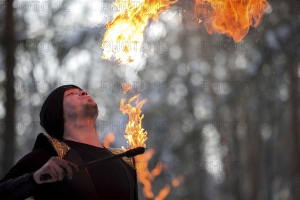 Belarus, Gomel, February 18, 2018. Russian holiday seeing off winter Maslenitsa.A man set fire to fire. Fire show, Europe