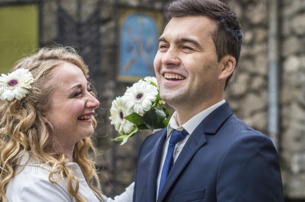 Newlyweds strolling around the city. Just married