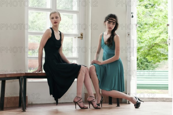 Two beautiful women sitting in a summer house, ST. Petersburg, Russia, Europe