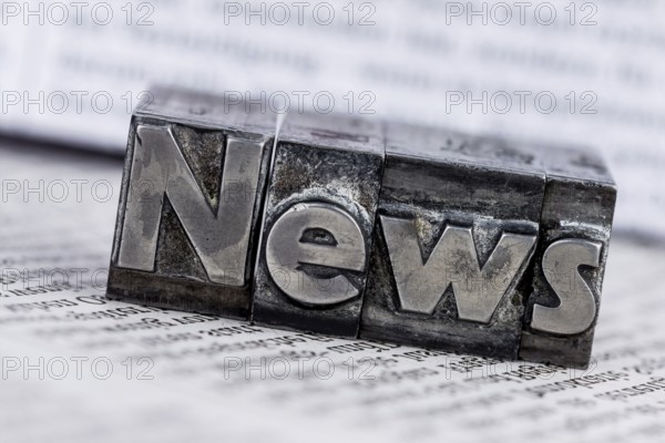 The word News was written in lead letters. Symbol photo for newsletters, newspapers and Information Austria