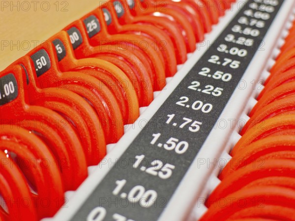 Optician, selection of different lenses with precise scale Austria