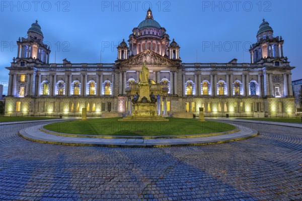 The illuminated Belfast City Hall at dawn