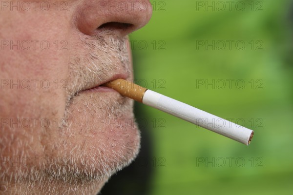 Man with a cigarette in his mouth