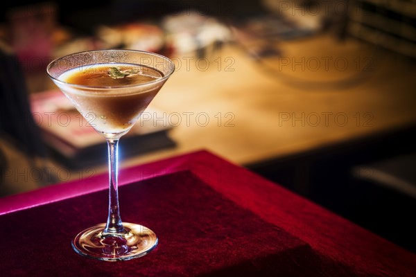 Chocolate and cream martini in cozy bar at night
