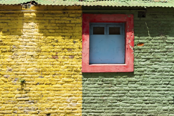 Colourful wall with windows in the La Boca district, Buenos Aires Argentina