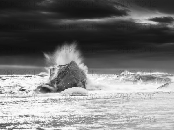 Diamond Beach, iceberg in the surf, near Jökulsarlon glacier lagoon, Vatnajökull National Park, Hornafjörður, South Iceland, Iceland, Europe