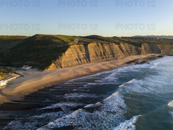 Magoito Beach and Cliffs at Sunset during Low Tide. Atlantic Ocean, Portugal. Golden Hour. Aerial View