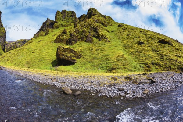 Scenic summer Iceland. The canyon Pakgil fast flowing shallow stream. The photo was taken Fisheye lens
