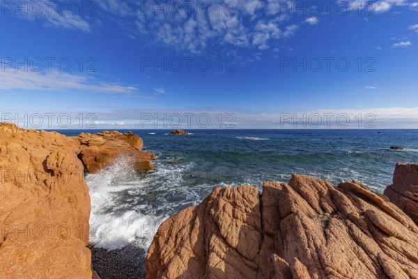 Coastal landscape with red rocks and surf in blue sky and sunshine, Spiaggia di Cala E'Luas, Ogliastra, Sardinia, Italy, Europe
