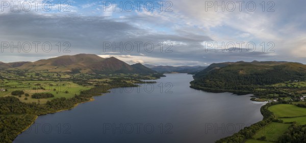 An aerial view of Bassenthwaite Lake in the English Lake District in warm eveing light