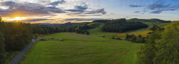 Panorama Of A Beautiful Sunset Over Gentle Rolling Hills In The Scottish Borders