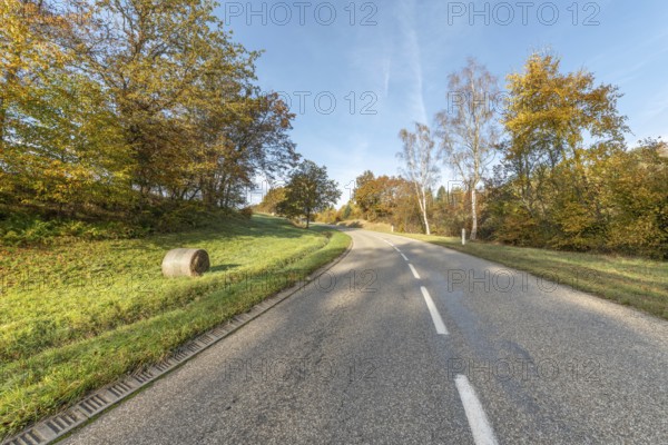 Road on a sunny morning in the mountains in autumn. France