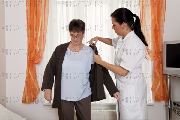 A carer caring for the elderly in a retirement home in Austria